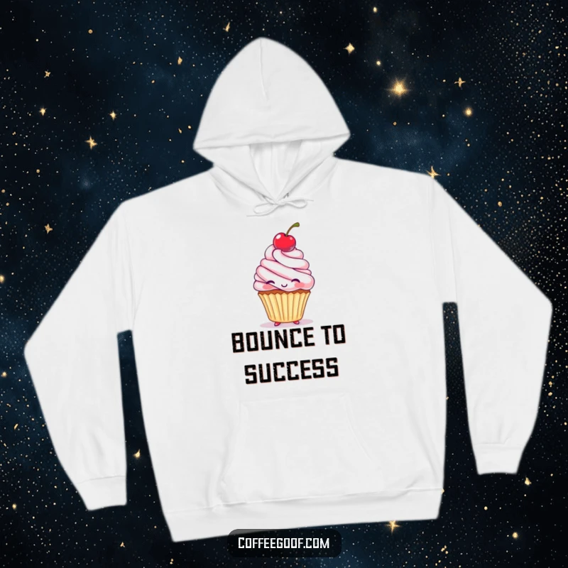 Funny Hoodie designed with a sweet cupcake character skillfully bouncing a cherry on its head, looking absolutely delighted and energetic.