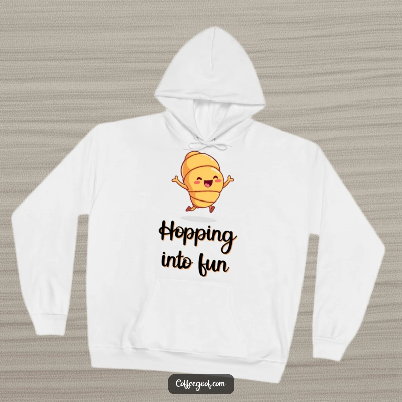 Funny Hoodie featuring a joyful croissant character in a cute hop, perfect for cozying up with breakfast-themed humor as a funny gift.